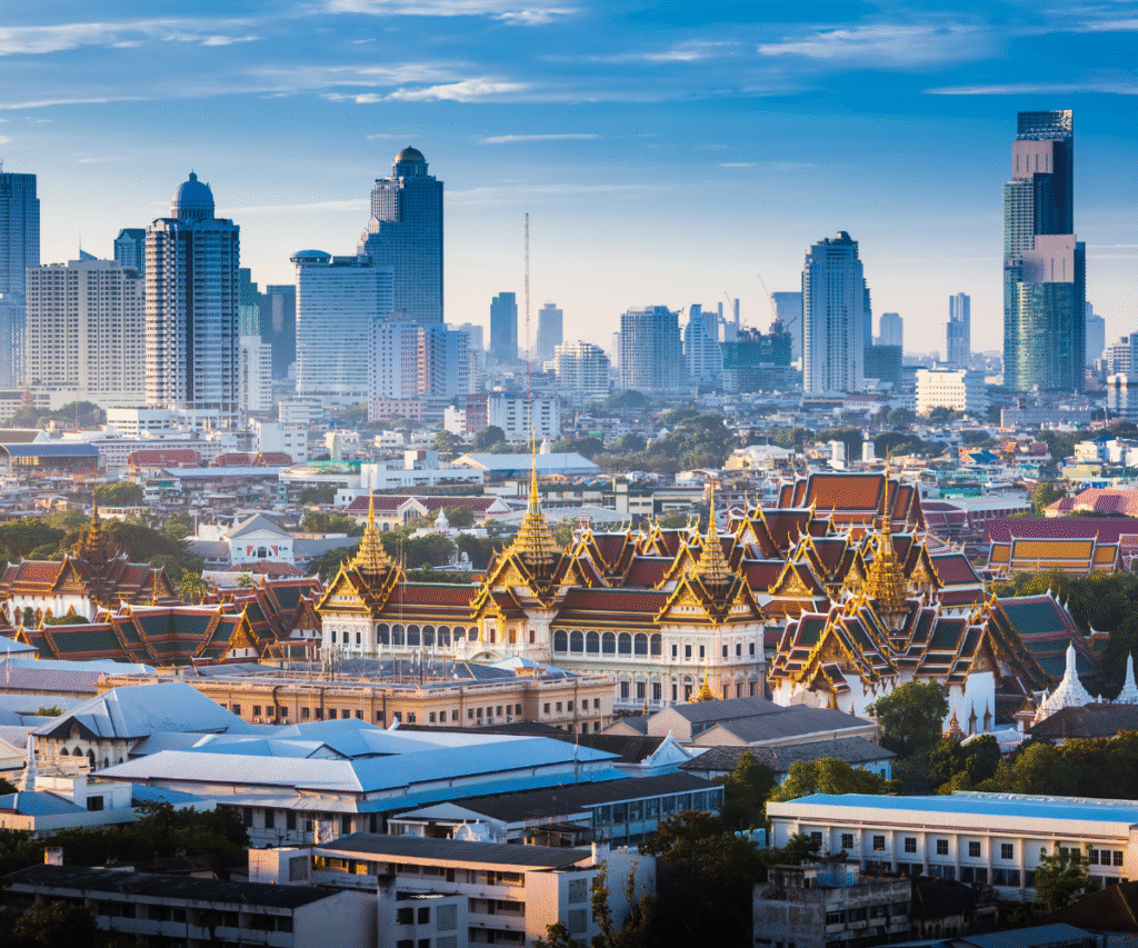 Bangkok skyline with Grand Palace in the foreground and modern skyscrapers behind
