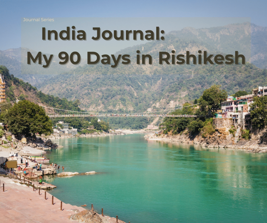 Suspension bridge and turquoise river in Rishikesh, India with colorful buildings on the banks