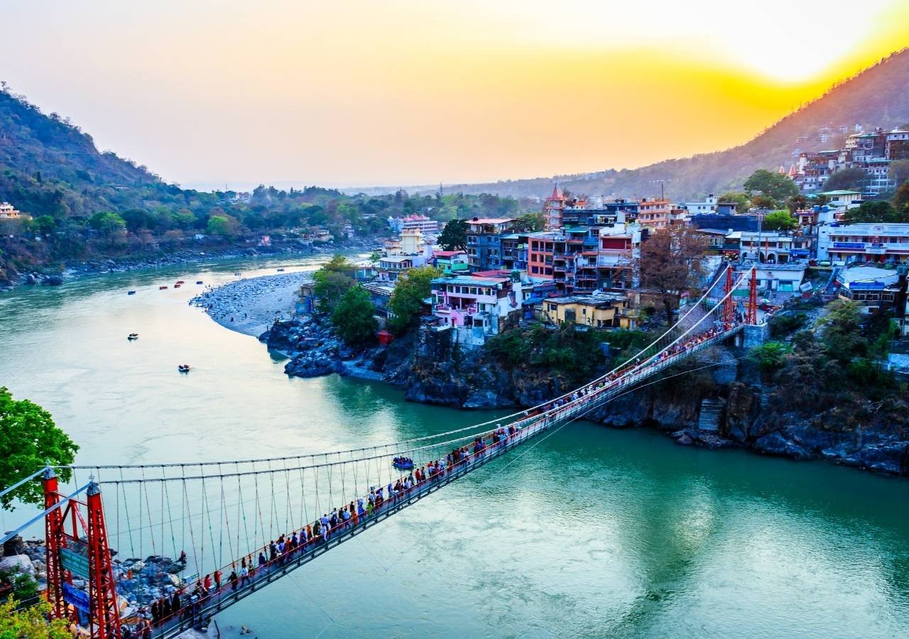 Suspension bridge over the Ganges River in Rishikesh at sunset