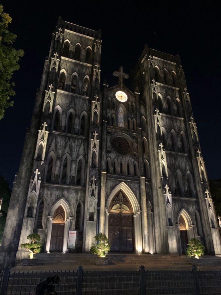 Gothic-style St. Joseph’s Cathedral lit up at night in Hanoi