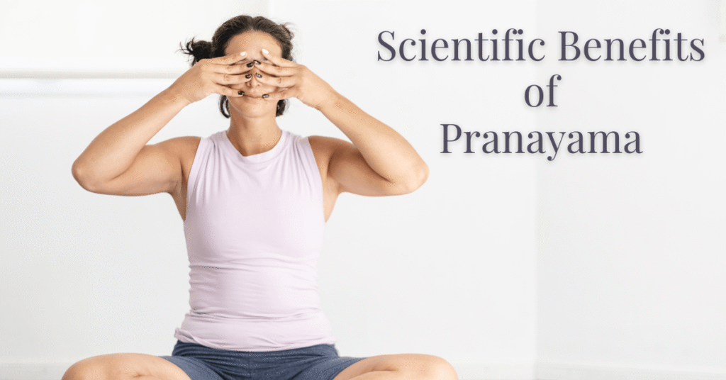 Woman practicing pranayama seated on a yoga mat with hands in Bhramari position