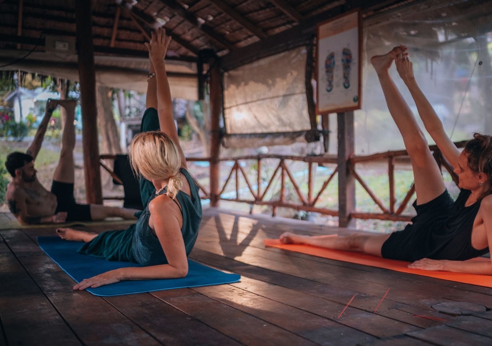 Yoga students practicing indoors at a rustic retreat center